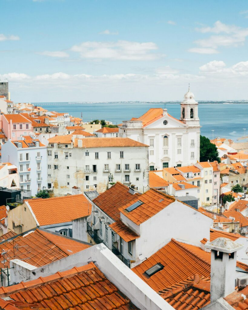 Lisbon, Portugal coast with white buildings and orange rooftops